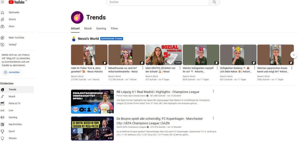 YouTube-Dashboard mit Trends in Musik, Gaming und Film, hervorgehoben durch bunte Miniaturbilder und Schlagzeilen.